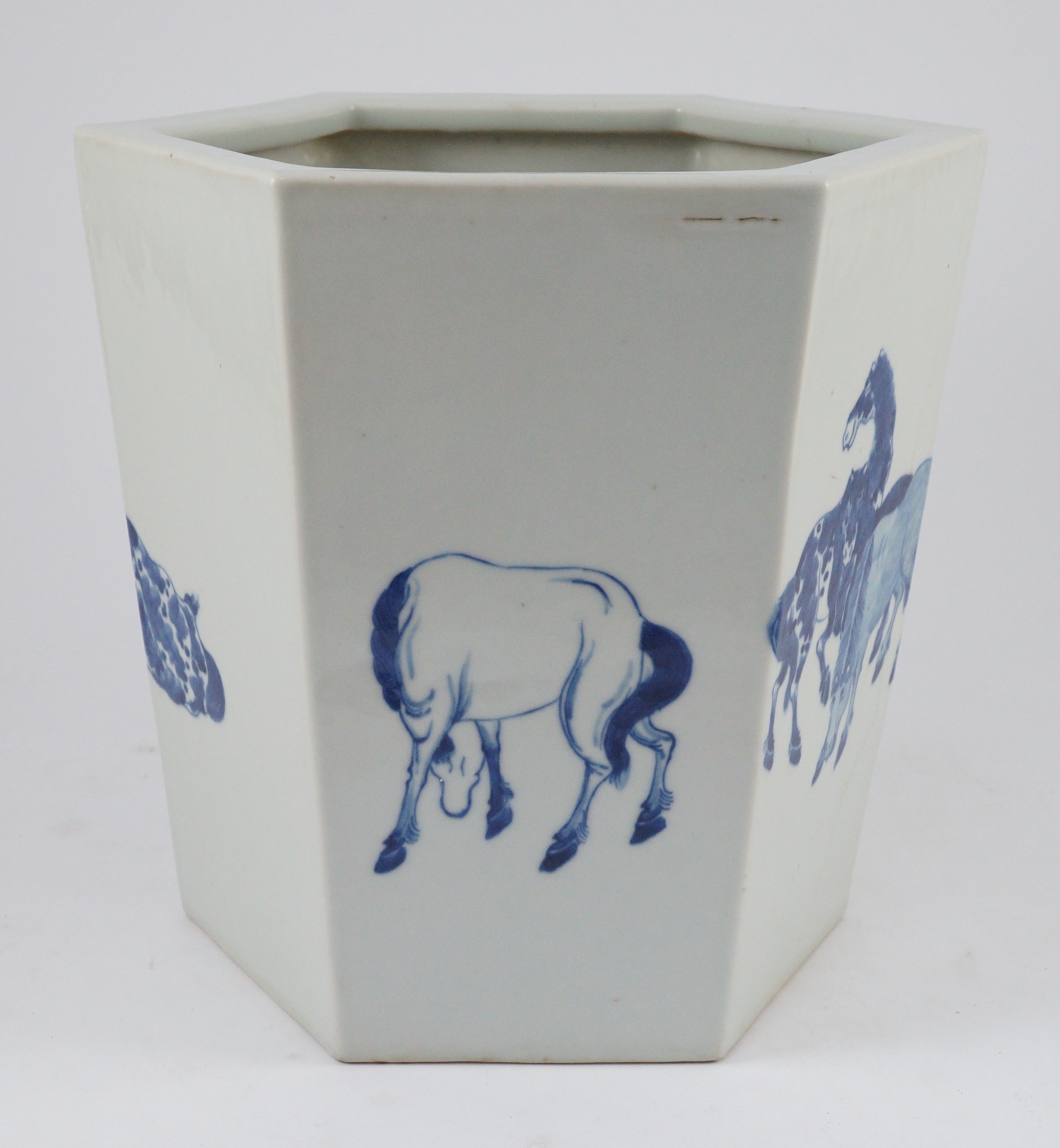 A Chinese blue and white hexagonal jardiniere, Kangxi mark but 19th/20th century, 26.5cm high, 28cm wide, cracked